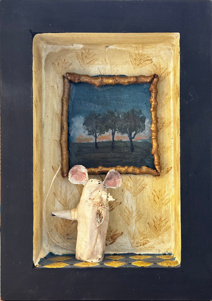 Mouse and painting of three trees in stenciled ochre room