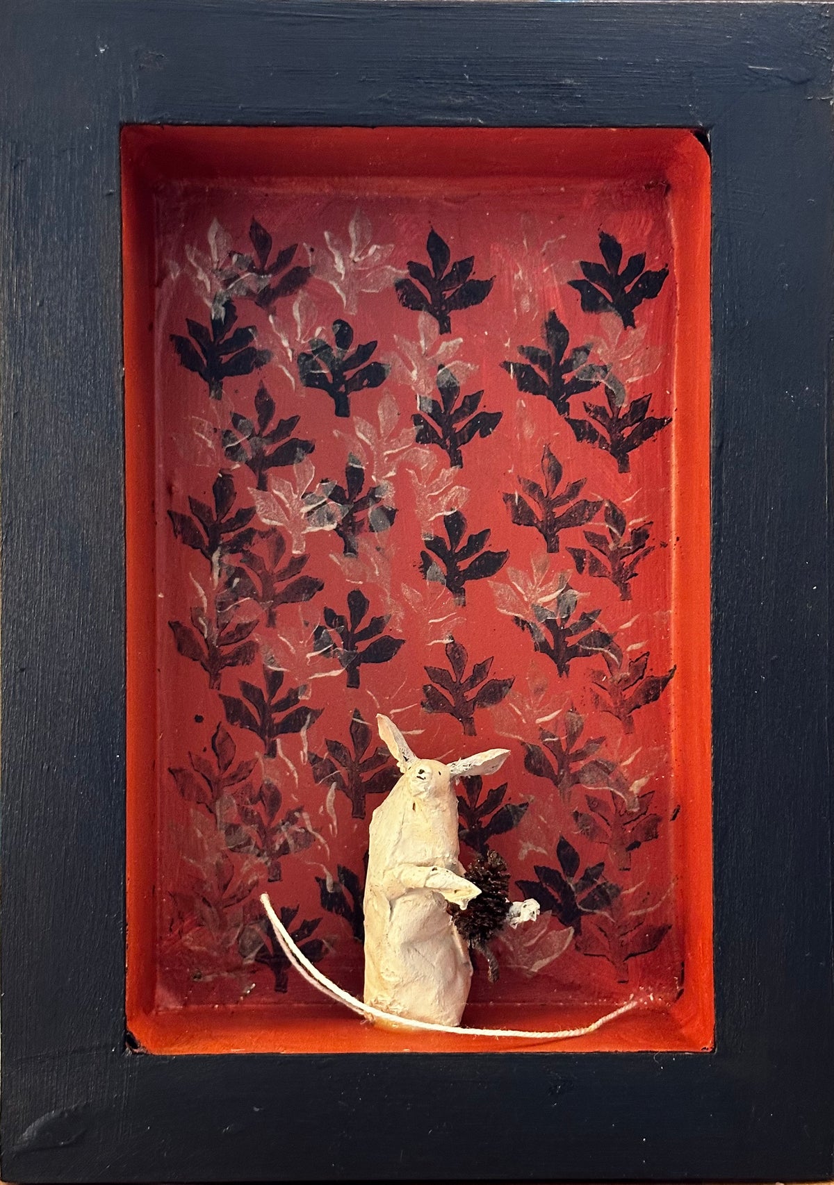 Mouse with alder cone in red room
