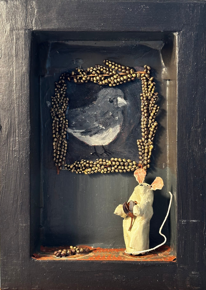 Mouse in gray room with painting of junco