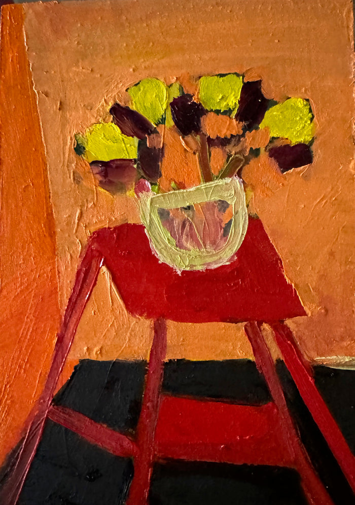 Red Table With Vased Blooms